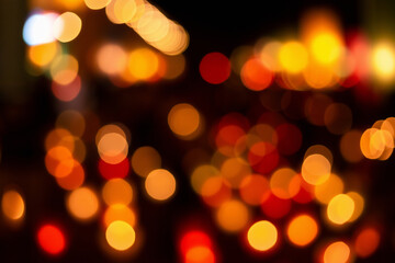 Christmas and Happy new year on blurred bokeh lights on black background.