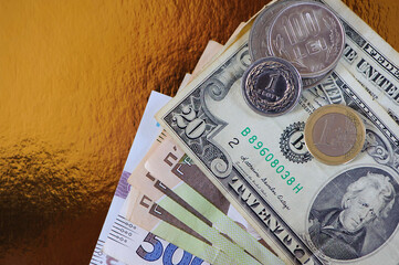 different banknotes and coins close-up