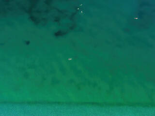 Aerial view of Kalamata beach with swimmers at daiylight