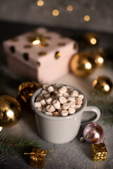 Mug for mockup near christmas tree and gift boxes.