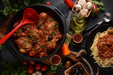 Chicken cacciatore with bell peppers, tomatoes, black olives. Italian food