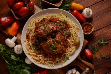 Italian chicken Cacciatore hunter's stew with spaghetti noodles