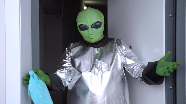Man decided to play prank on friends and came to visit them in alien costume. Outfit for Halloween themed party. Humanoid came into direct contact with humanity.