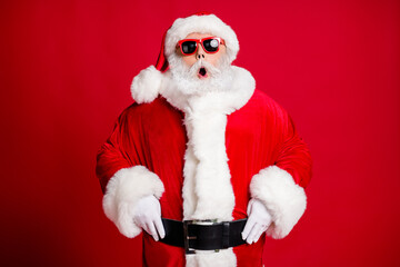 Portrait of his he nice handsome amazed stunned funny bearded Santa stupor unexpected reaction omg emotion eve noel isolated bright vivid shine vibrant red color background
