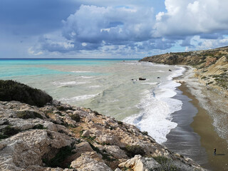 Fototapeta na wymiar The Mediterranean seashore and the Beach of Aphrodite. Petra tou Roumiou, Cyprus.