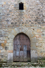Vertical view of the entrance door to the 15th century Torre de los Velarde, in Santillana del Mar, Spain, October 1, 2020