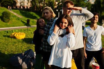 Young multi ethnic group of people in open air cinema.