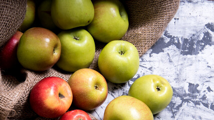 A bunch of red and green apples in a bag on a black and white background,close-up,background,Wallpaper,postcard,advertising