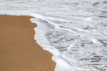 Soft white waves on the beach
