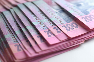 Money Ukrainian hryvnia big bundle of bills, close-up copy space