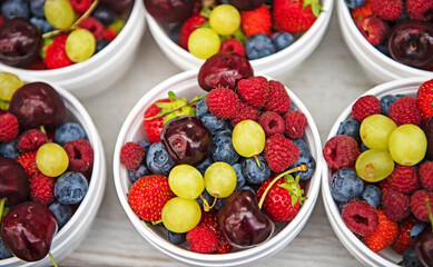 bowls of fruits and berries