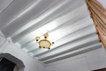 white ceiling with antique lamp