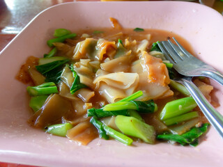 Noodles in a pink plate