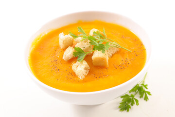 pumpkin or carrot soup on white background