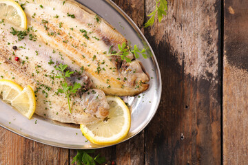 fish cooked with lemon and herbs