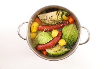 sausage, vegetable and broth on board