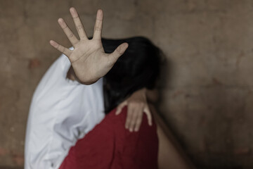 Sad woman raised her hand for stop domestic violence.