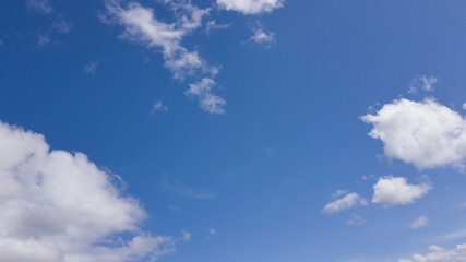 Naklejka na ściany i meble white clouds floating in blue sky