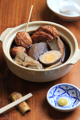 Oden(Japanese hotchpotch). vegetables, fish dumplings and various other articles of food stewed in a thin soy soup