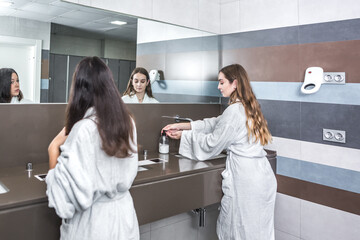 Young woman in bathroom of spa salon