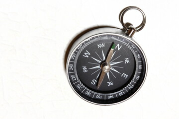 Compass placed on a white table / コンパス (方位磁針) ～安全登山～
