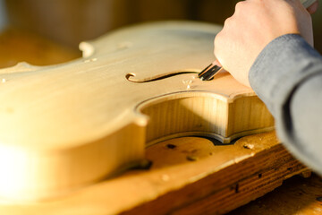 luthier working on a violin
