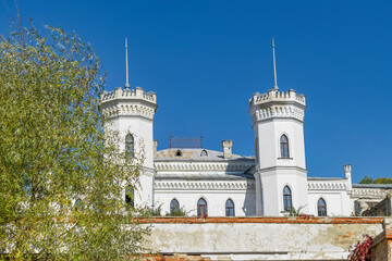 Fototapeta na wymiar Sharovsky castle with trees of the Kharkiv region in autumn