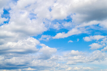 Naklejka na ściany i meble Sky and clouds panorama. Sunny summer day. White clouds and blue sky.
