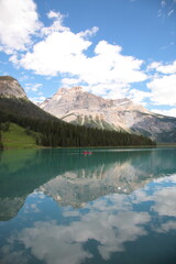 Fototapeta na wymiar View of Bow lake with people Canoeing on lake during summer in Banff National Park, Canadian Rockies, Alberta, Canada.