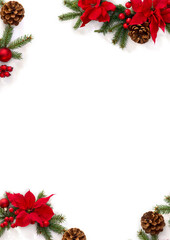 Christmas decoration. Frame of flowers of red poinsettia, branch christmas tree, pine cones, ball, red berries on a white background with space for text. Top view, flat lay