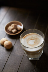 Coffee with milk on dark wooden background. Close up.	