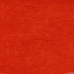 Red vintage and old looking crumpled paper background. Retro cardboard texture. Grunge paper for drawing. Ancient book page. Present wrapping.