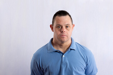 man with down syndrome posing for photography with white background