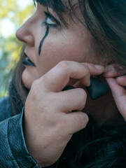 Woman posing in disguise for Halloween in a forest