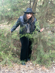 Woman posing in disguise for Halloween in a forest