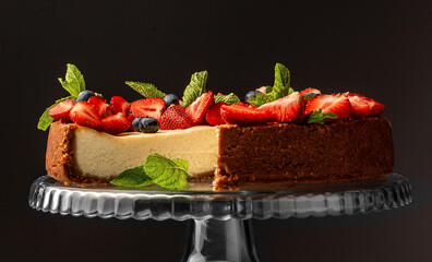 slice of strawberry cheesecake with fresh berries and mint, organic summer dessert pie cheesecake strawberries decorated with mint leaves, catering, banner, menu, recipe, place for text