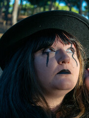 Woman posing in disguise for Halloween in a forest