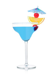 Blue lagoon cocktail in margarita glass with orange slice and sweet cherry with umbrella on white.