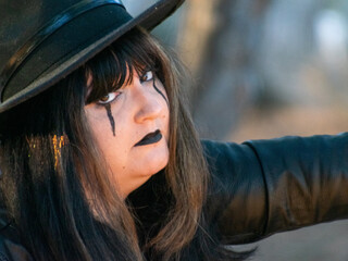 Woman posing in disguise for Halloween in a forest
