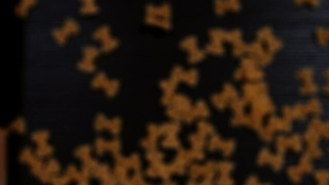 Delicious farfalle pasta on a black background. Super slow motion. Macro