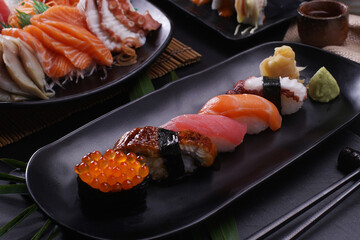 japanese sushi food set. Maki ands rolls with tuna, salmon, and shrimp. Rainbow sushi roll, uramaki, hosomaki and nigiri.