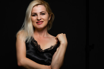 Fototapeta premium Young woman portrait. Closeup beauty studio shoot. Healthy clean skin and perfect makeup on beautiful face of white model with short blonde hair. Beautiful girl.