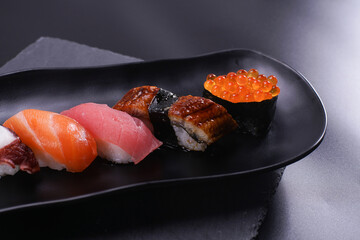 japanese sushi food set. Maki ands rolls with tuna, salmon, and shrimp. Rainbow sushi roll, uramaki, hosomaki and nigiri.