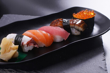 japanese sushi food set. Maki ands rolls with tuna, salmon, and shrimp. Rainbow sushi roll, uramaki, hosomaki and nigiri.