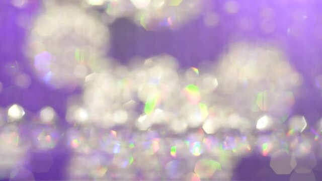 Blur crystal object that glitters in the purple or violet light background
