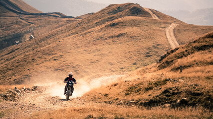 Crossing the mountains on a motocross dirt bike