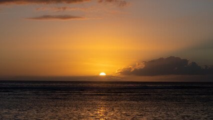 Fototapeta na wymiar Sunset on the Indian Ocean, at Saint Gilles les Bains