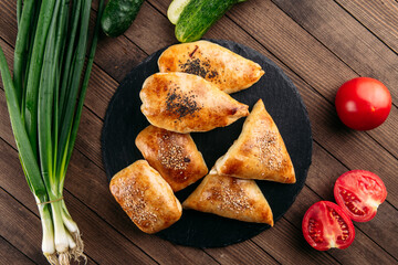 Different oriental baked pie with meat samsa