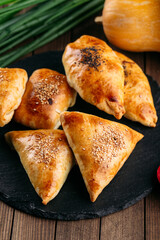 Different oriental baked pie with meat samsa
