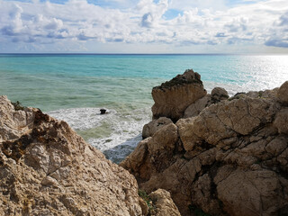A sunny December day in Petra tou Roumiou Beach. The Rock of Aphrodite, Cyprus Island.